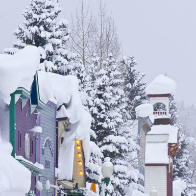 Heavy snow blankets storefronts on Elk Avenue, Crested Butte, Colorado's main street.